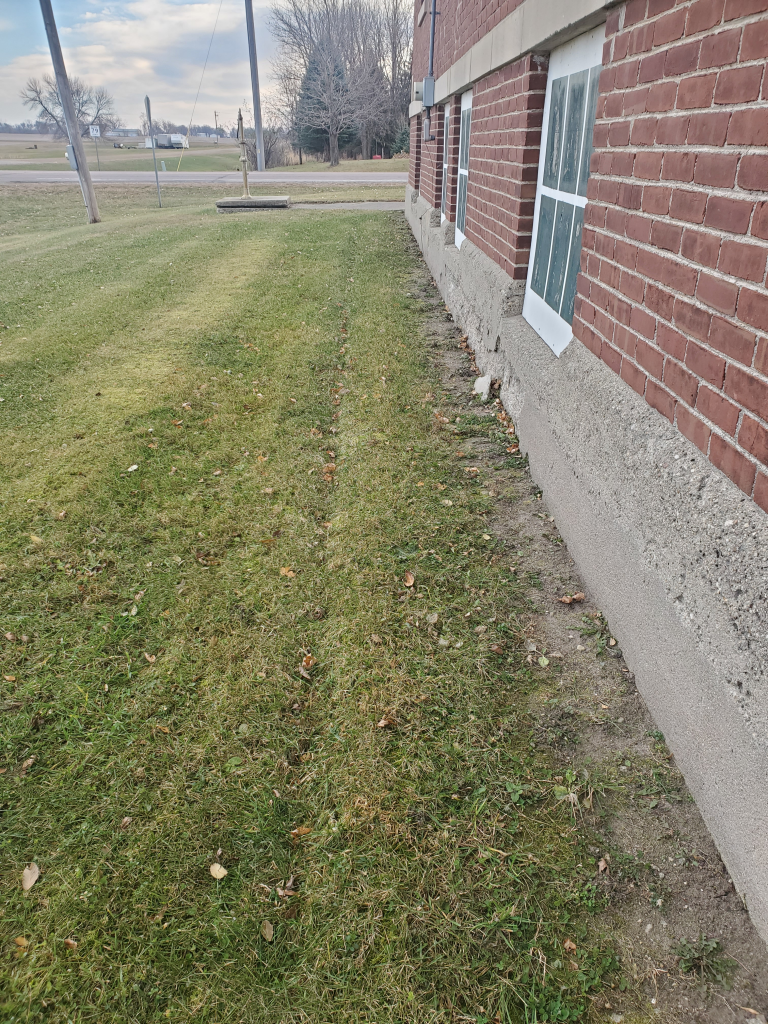 Regrading around the external foundation to improve drainage